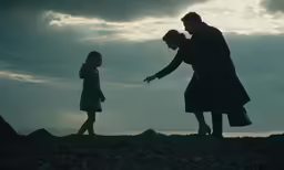 the two people are pointing their fingers at the ground