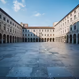 a wide empty, empty courtyard in a large building