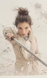a woman holding a sword in one hand and a fist in the other