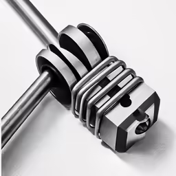 several metal pieces in a row on a table