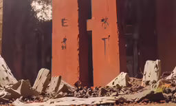 a building that has some wood with the letter e painted on it