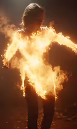 a woman standing in a room that has flames around her