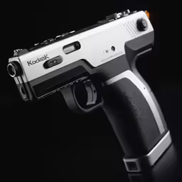 a small silver gun sitting on top of a table