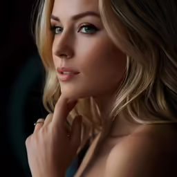 a very attractive blonde woman wearing very big earrings