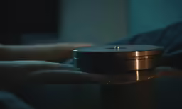 the round object has been placed on top of a metal post