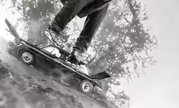 a person riding on a skateboard near the ground
