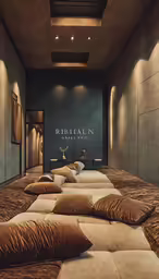 a large bed room with many pillows on it