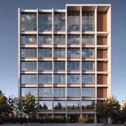 a modern office building with glass windows and a sky background