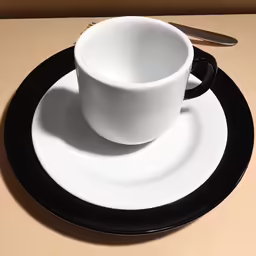 a picture of a white plate with a cup and saucer