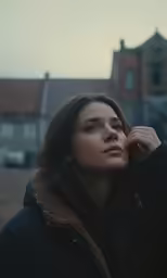 a woman talking on her cell phone in the city