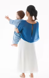 woman in blue blouse holding small child