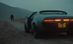 a black car in the middle of a road