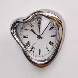 a wall clock on the side of a white wall