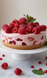 a white cake with fruit on top of it