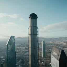 an aerial view of several glass buildings