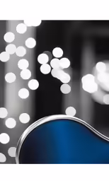 an abstract background with a blue guitar and lights