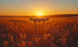 an orange sunset with an aerial camera attached to it