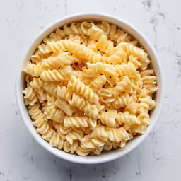 a bowl of noodles is shown with broth