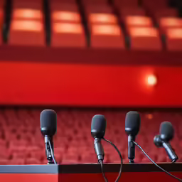 the microphones on the stand are ready to be heard