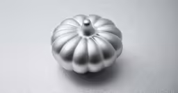 a silver vase that is sitting on a table