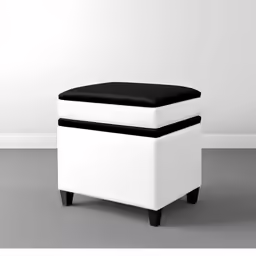 the small white ottoman is next to a wall