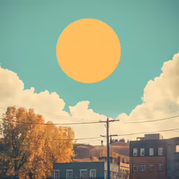 a sun is over power lines in front of houses
