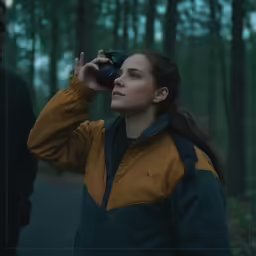 there is a young woman that is looking up