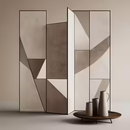 three beige and black vases in front of a geometric screen