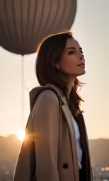 a woman in a coat is staring at the sky