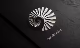 the logo of a company is shown on a dark surface