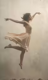 a woman is dancing in the air under water