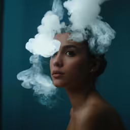a young woman in smokey makeup and smoky eyes