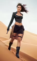a young woman wearing leather clothes walking in the desert