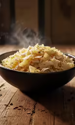 a bowl full of noodles and steam rising out of it