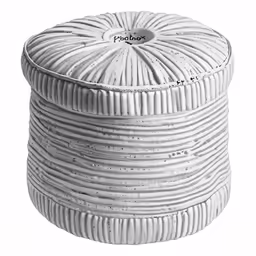 a white decorative item with wavy stripes