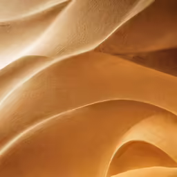 a sand dune with a yellow streaky wave