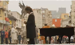 a girl standing in the middle of a city with an umbrella