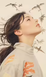 a woman looks up at some bird on her head