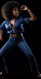 a young black woman in a blue shirt and pants dancing