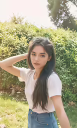 an image of a young woman posing with her hair in the air