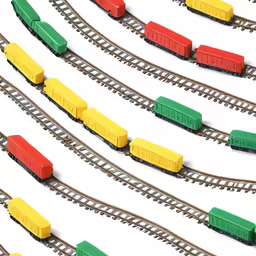a bunch of toy trains sitting on the tracks