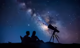 two people watching the milky as they look at the stars