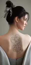 a woman wearing an off the shoulder tattoo