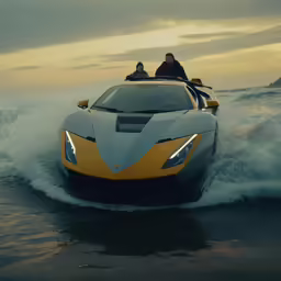 a couple riding on top of a white and yellow car