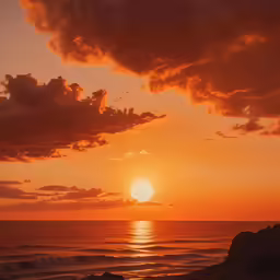 a lone person stands near the ocean with a surfboard