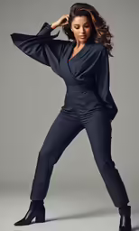 a woman posing in black clothing