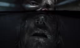 the face of a man in the reflection of the mirror