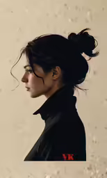 a female with a hair bun in her topk