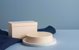 a white box and a piece of blue fabric