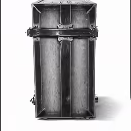 a very large metal box on a white surface